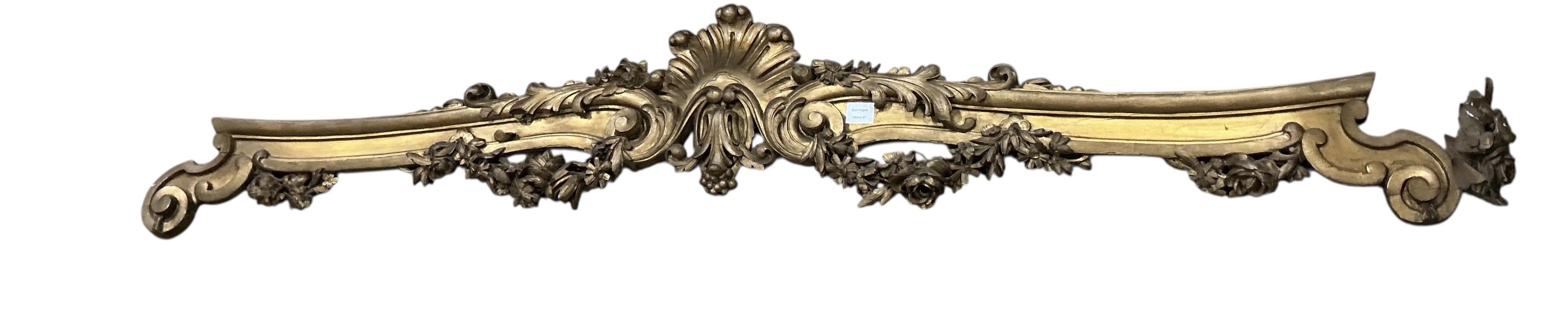 A Victorian carved giltwood pediment, length 200cm